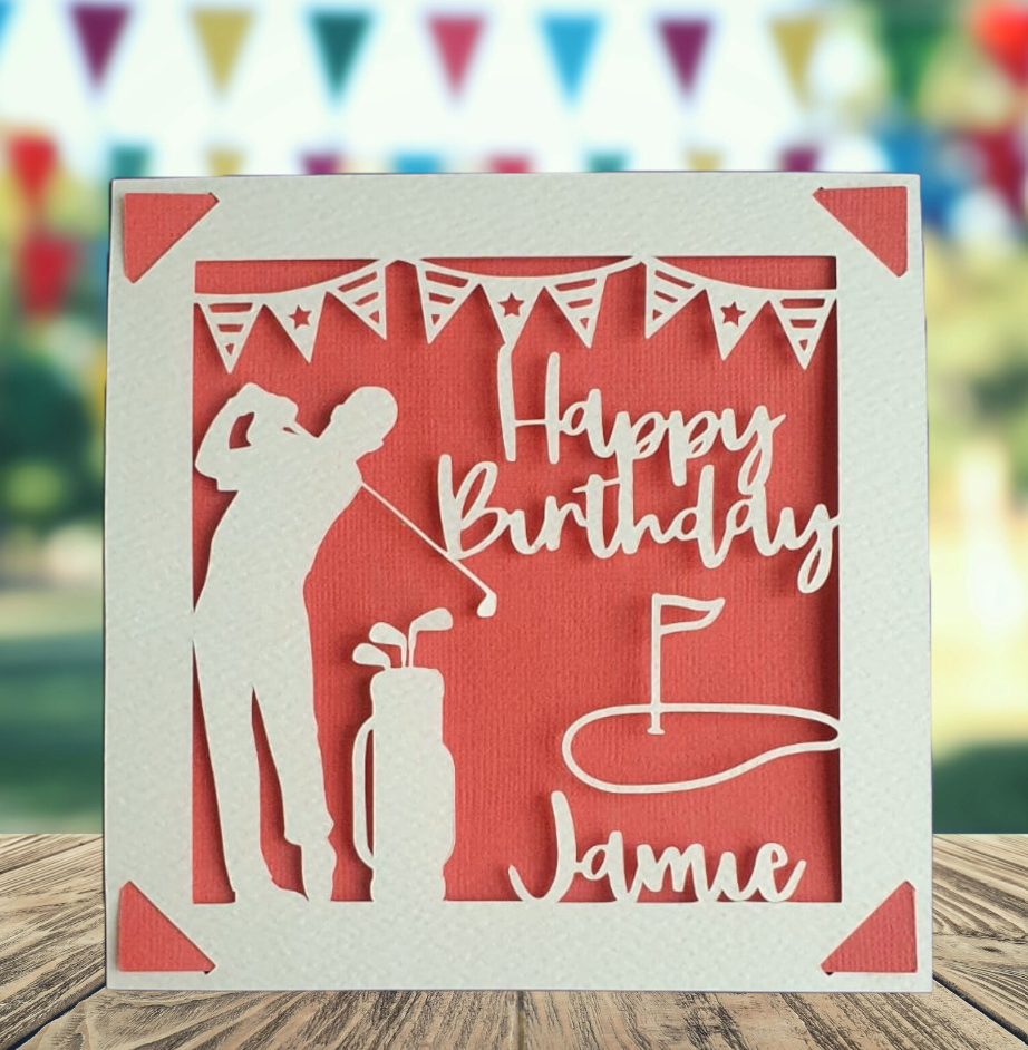 A personalised golfing birthday card for someone who loves golf. The card is fully customisable with the recipient's name. The card features a figure playing golf, with their golf club, bag and a cut out of a golf hole with flag. The background colour is red.