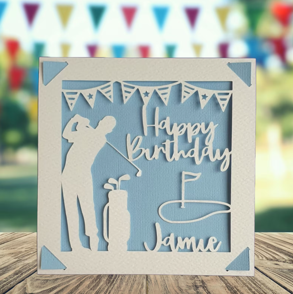 A personalised golfing birthday card for someone who loves golf. The card is fully customisable with the recipient's name. The card features a figure playing golf, with their golf club, bag and a cut out of a golf hole with flag. The background colour is blue.