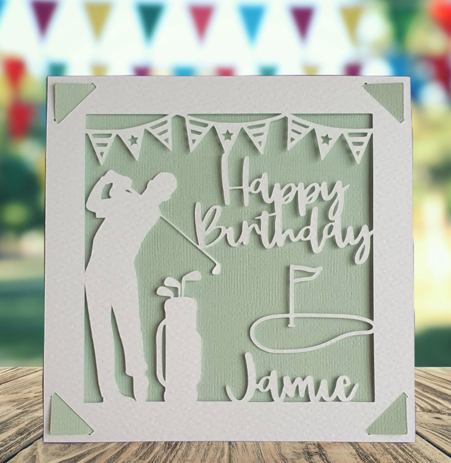 A personalised golfing birthday card for someone who loves golf. The card is fully customisable with the recipient's name. The card features a figure playing golf, with their golf club, bag and a cut out of a golf hole with flag. The background colour is light green.