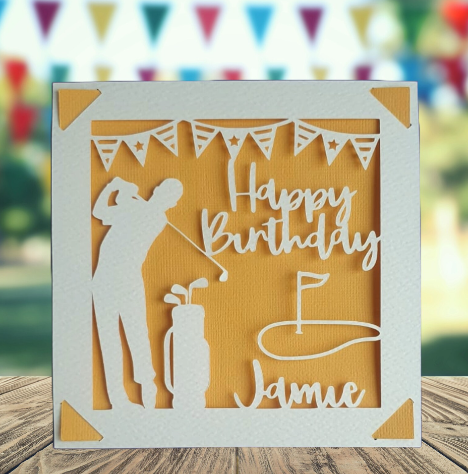 A personalised golfing birthday card for someone who loves golf. The card is fully customisable with the recipient's name. The card features a figure playing golf, with their golf club, bag and a cut out of a golf hole with flag. The background colour is orange.