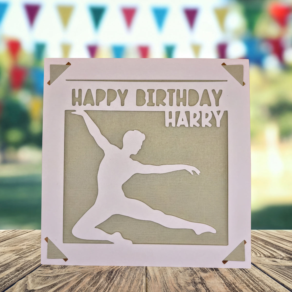 A birthday card with a silhouette of a person dancing, and the text "Happy Birthday Harry" written on it.