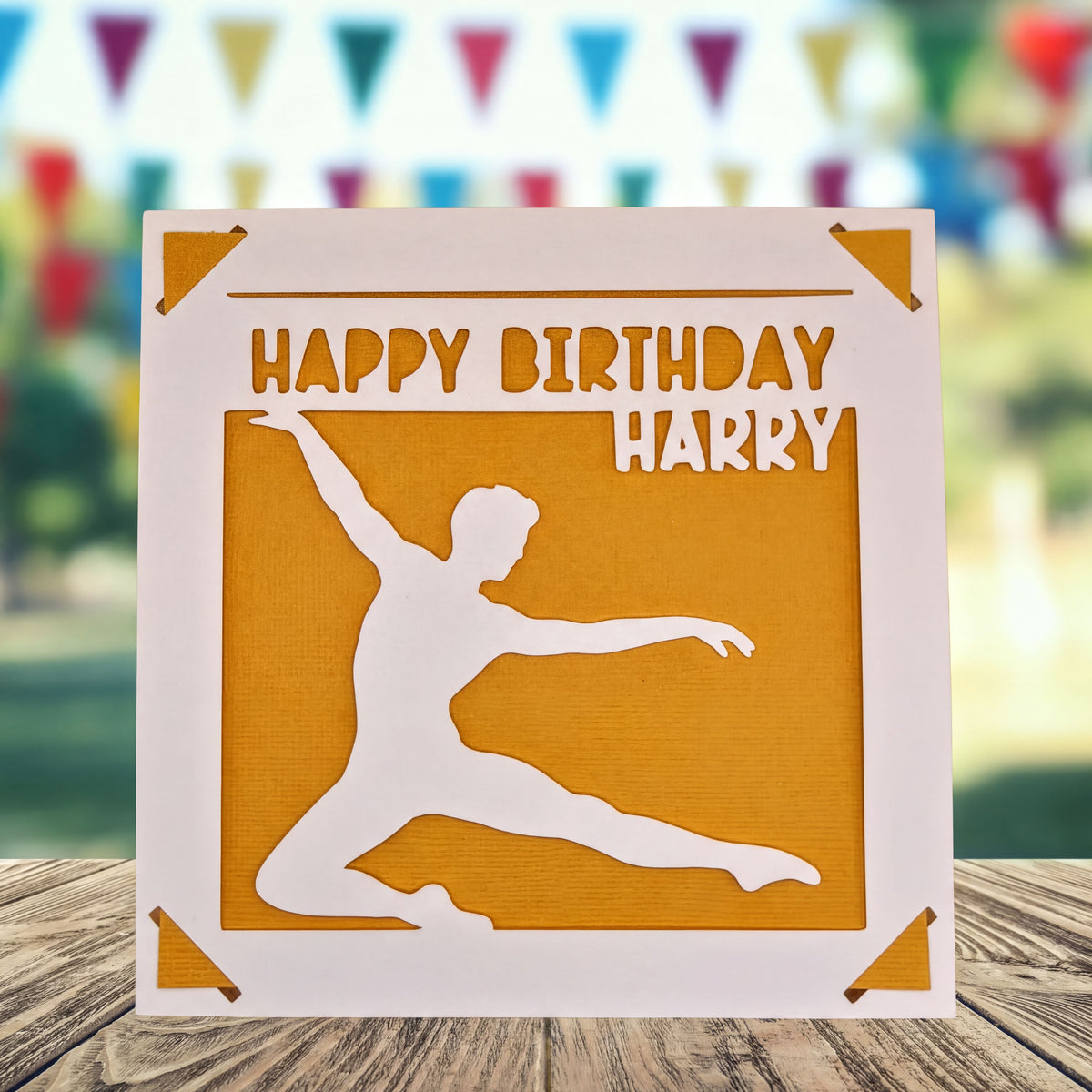 A birthday card with a silhouette of a person dancing, and the text "Happy Birthday Harry" written on it.