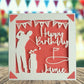 A personalised golfing birthday card for someone who loves golf. The card is fully customisable with the recipient's name. The card features a figure playing golf, with their golf club, bag and a cut out of a golf hole with flag. The background colour is red.