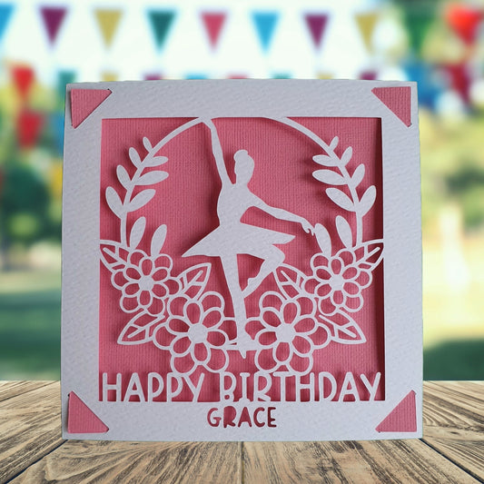 A personalised birthday card with a ballet dancer illustration, made from hammered white card, with a pink backdrop, with the text 'happy birthday' and the option to add a name and age.