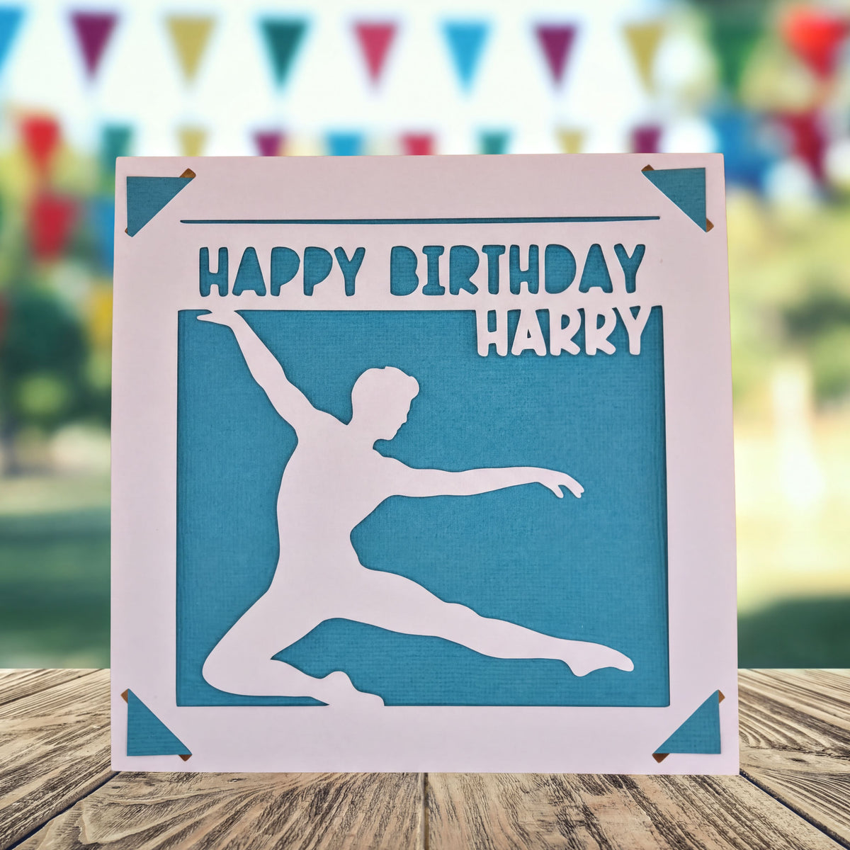 A birthday card with a silhouette of a person dancing, and the text "HAPPY BIRTHDAY HARRY" on it.