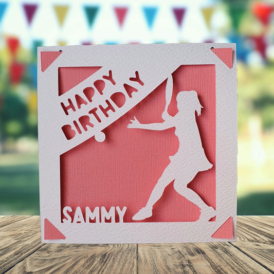 A personalised birthday card with a pink background, featuring a silhouette of a female tennis player and the text 'Happy Birthday' with the name of the recipient.