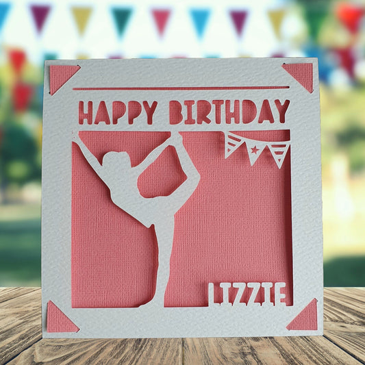 A personalised birthday card with a yoga pose silhouette, made from hammered white and pink coloured card, with the text 'Happy Birthday' and a space to add a name and age if required.